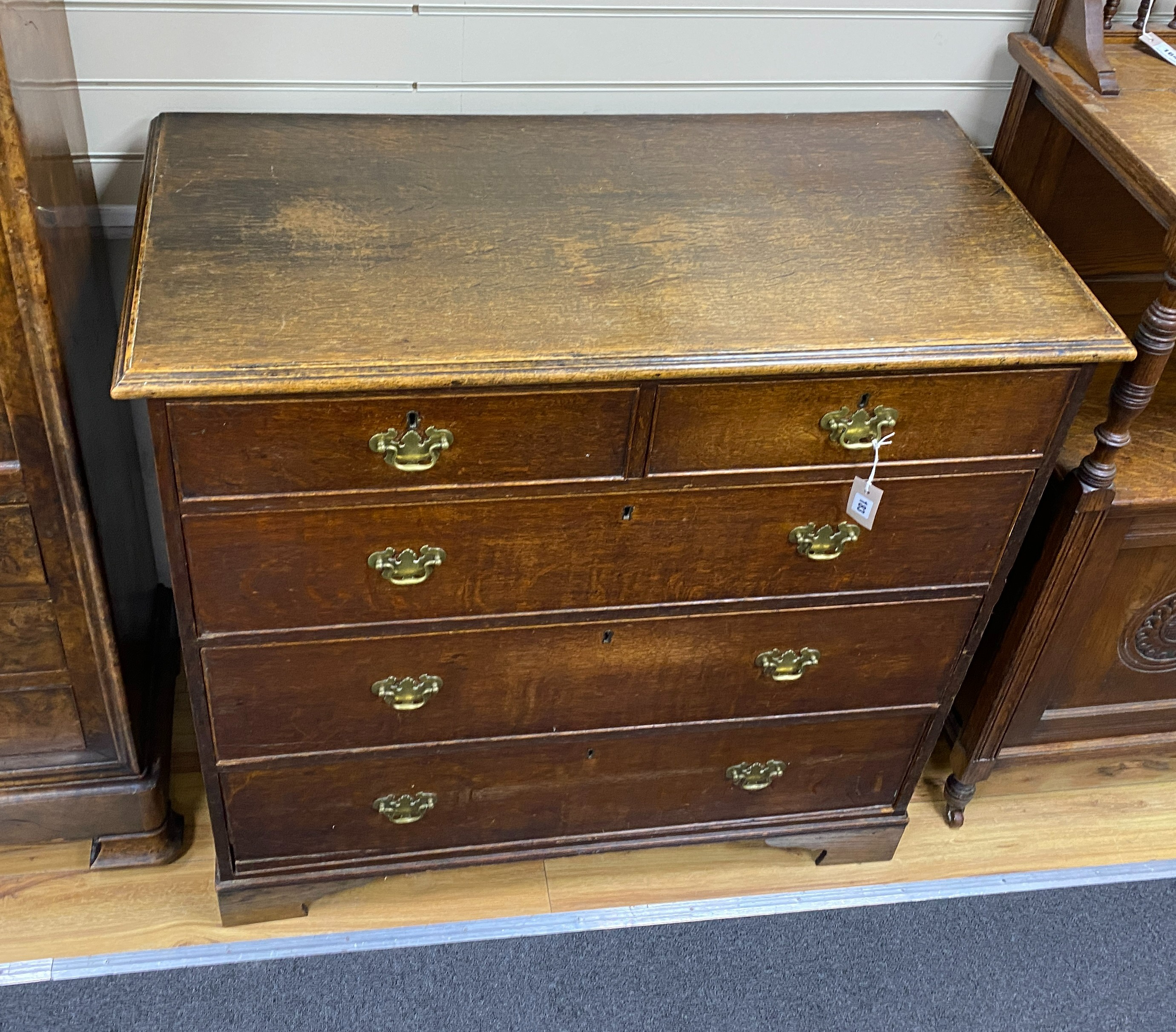 A George III provincial oak chest, width 106cm, depth 53cm, height 102cm.